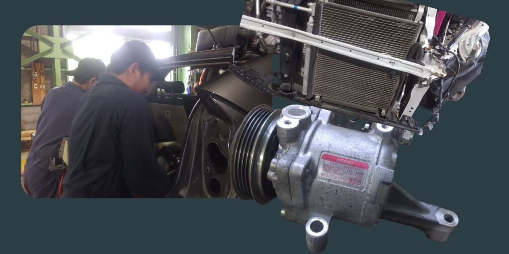 整備工場で車のエアコン修理を行う様子